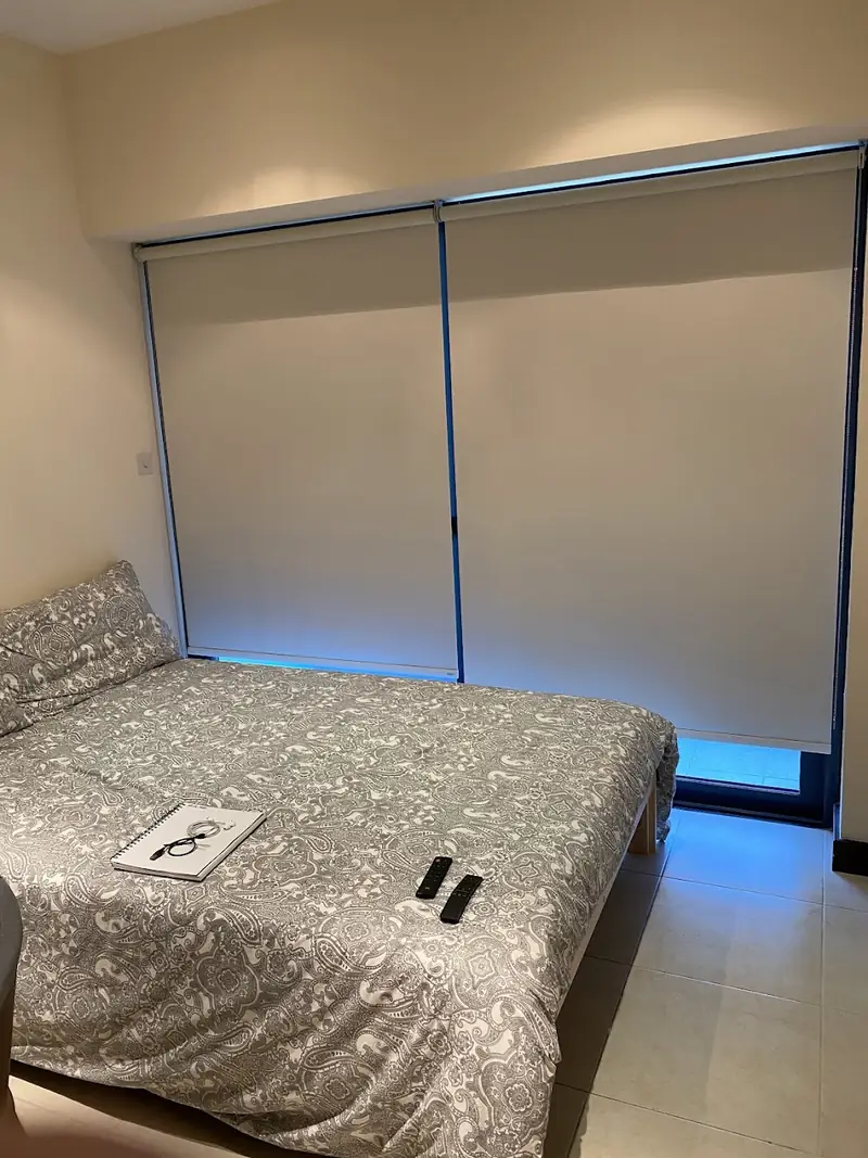 Blackout roller blind fitted by Blindtex in a bedroom
