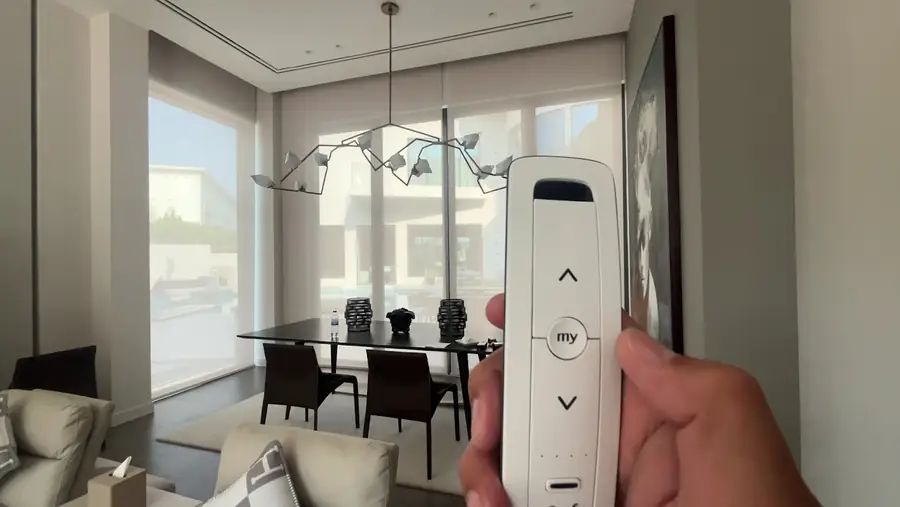 Motorised blind remote control and wall switch installed by Blindtex